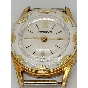 Vintage Manson Gold-Tone Watch with White Enamel Finish and Ornate Leaf Detail